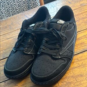 Air Jordan low, Travis Scott edition. Backwards swoosh